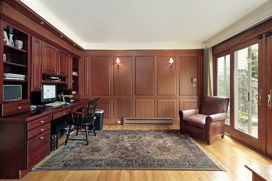 library and office in luxury home with cherry wood paneling