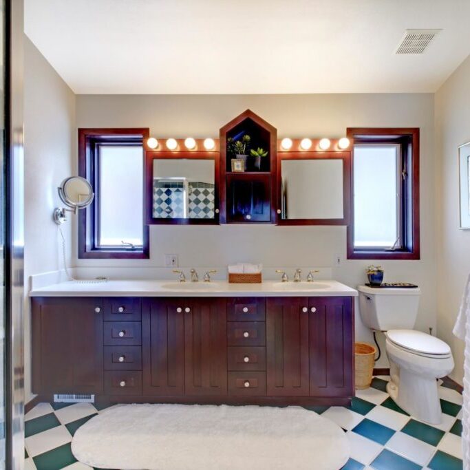 a bathroom with built in cabinets